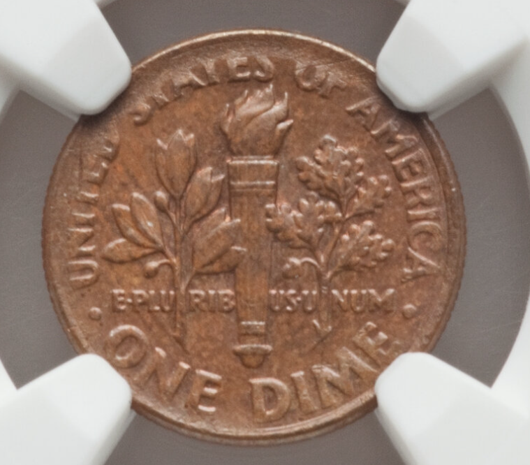 1999 Roosevelt dime with missing obverse clad layer showing one copper side and one normal silver side