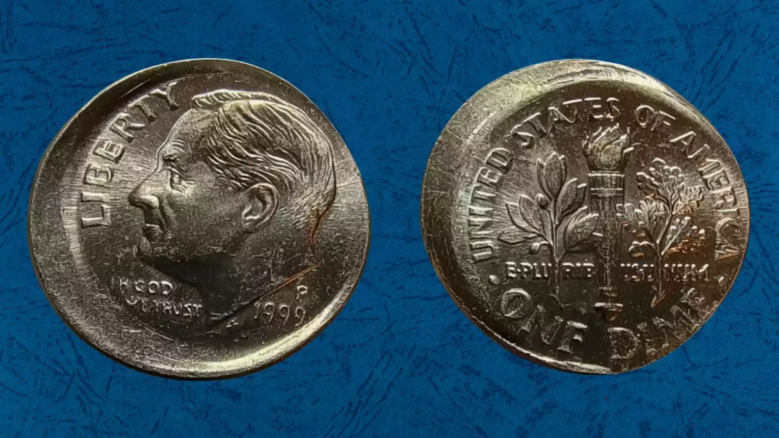 1999 Roosevelt dime with major off-center strike showing blank crescent and visible date in surviving design